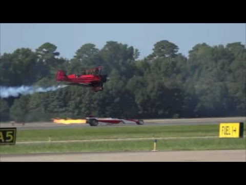 A Jet Biplane races a Jet Dragster