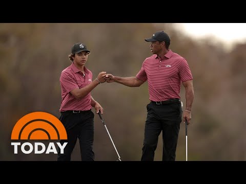 Charlie Woods celebrates with dad Tiger after his first hole-in-one