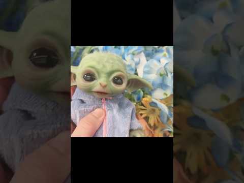 Baby Yoda smells the fake flowers  #babyyoda