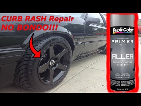 Curb Rash Repair on Black Wheel