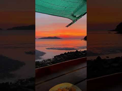 Eating Pad Thai on Long beach in Koh Chang, Thailand