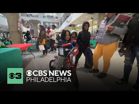 Children and families receive toys from CBS News Philadelphia's Joy of Sharing campaign