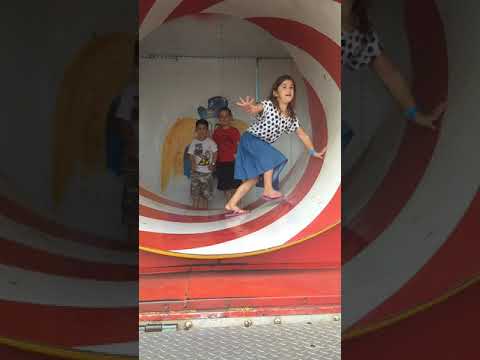 Kids navigating the funhouse tunnel at the Brown County Fair