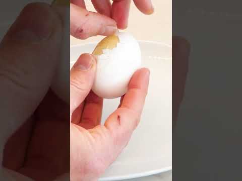 Mixing an egg in its shell to make a golden egg