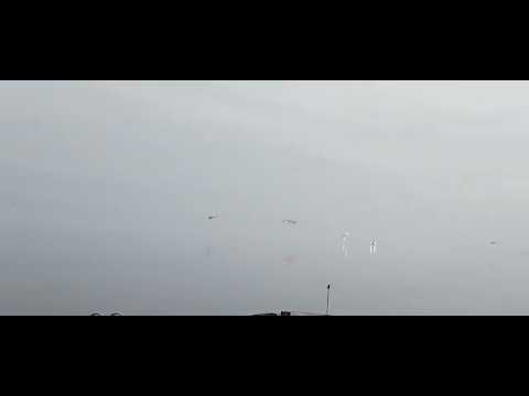 Russian helicopters low pass over lake and hit one of them by Ukrainian troops.