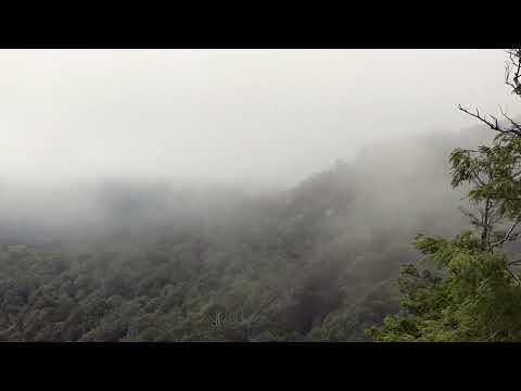 Tranquil Time-Lapse of Rolling Clouds Over Mountain Top