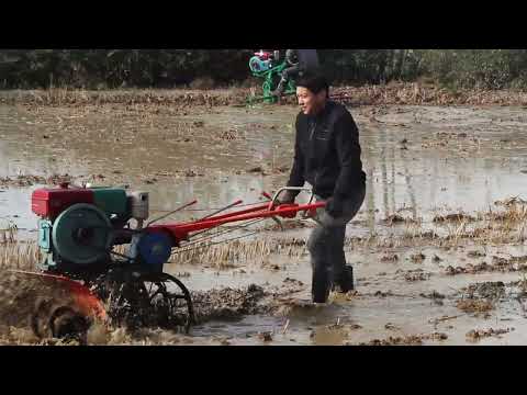 Hand-held small paddy field cultivator