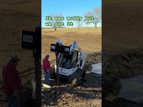 Driving post for a dock on new pond #shortsvideo #ponds #docks #bobcat