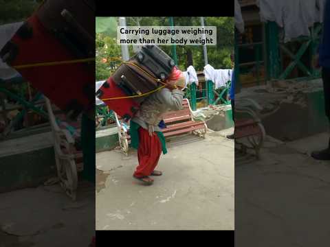 Nepali woman carrying luggage more than her body weight. #shorts #shortsindia #shortsvideo #viral