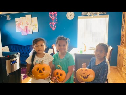 Kids carving Pumpkin