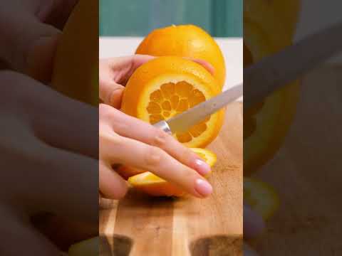 How to cut and serve an orange? Serve oranges in a bowl that is made out of its peels.