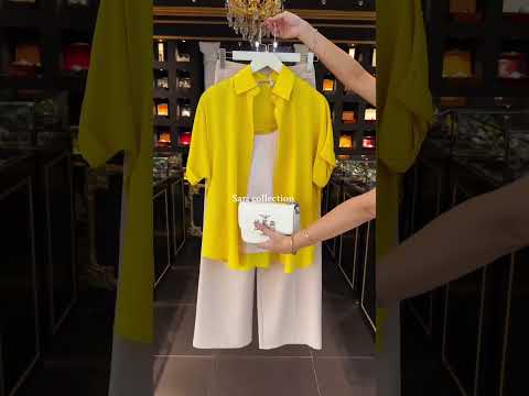 vibrant yellow blouse paired with elegant cream wide-leg pants #FashionInspiration #EffortlessStyle"