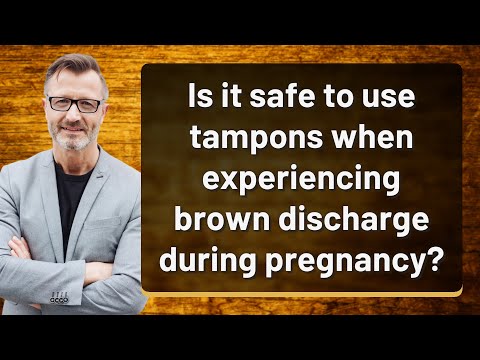 Is it safe to use tampons when experiencing brown discharge during pregnancy?