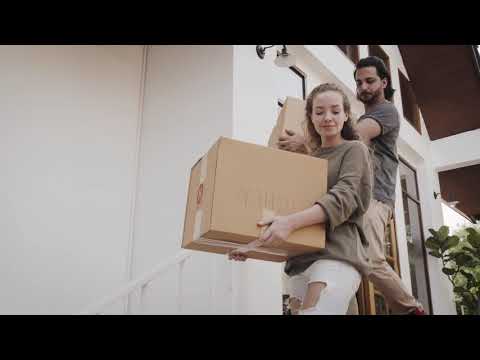 Couple Carries Moving Boxes | Copyright Free Video Footage