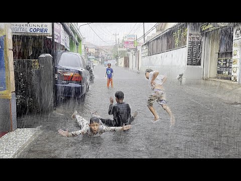 walking in heavy rain, seeing children playing, the relaxing atmosphere and sound of heavy rain