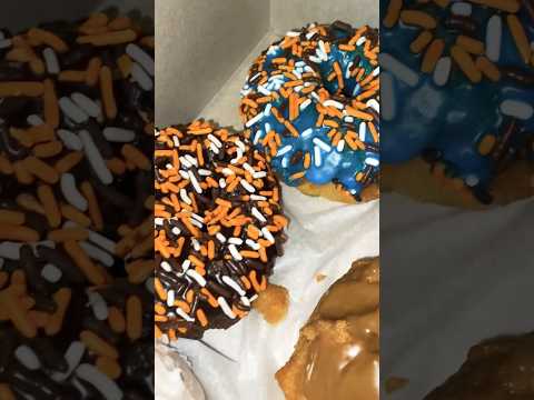 Halloween donuts and a apple fritter from Winchell’s Donut House #blueberry #orange #maple #donuts