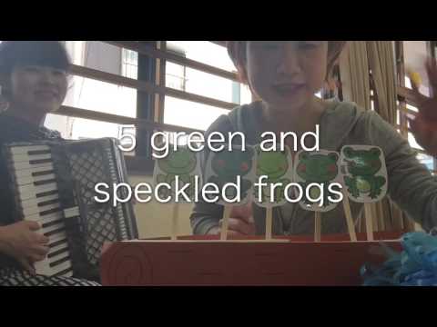 5 green and speckled frogs