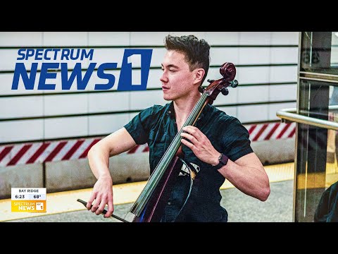 Electric Cellist Comforts New Yorkers (Channel 1 News Spectrum) - Eyeglasses