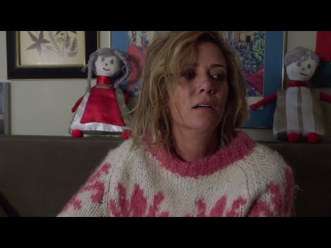 Kristen Wiig crying in a sweater