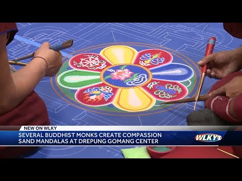 Several Buddhist monks create compassion sand mandalas at Drepung Gomang Center