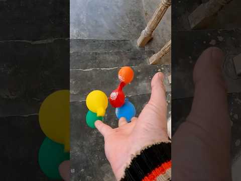 Rainbow colorfull water balloons throw on stairs in slowmotion