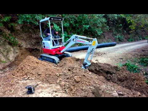 Installing a Culvert Pipe with a Mini Excavator - Takeuchi TB217R