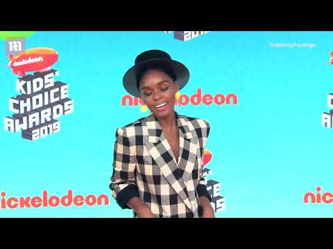 Pretty in plaid! Janelle Monae flashes peace sign at KCAs