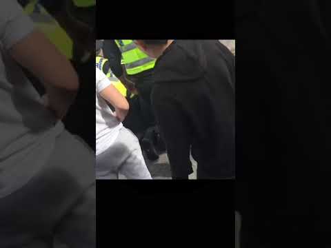 POLICE OFFICER KNEELS ON FOOTBALL FANS NECK WHILST TWO OTHERS PIN HIM DOWN AND PEPPER SPRAY HIM