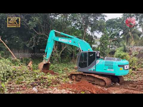 Kobelco SK200 Excavator Cleaning Trees and Dirt