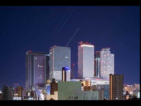 【タイムラプス】名古屋駅前高層ビル群と星の軌跡