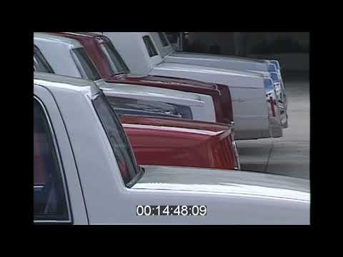 Looking at cars at a Cadillac dealership in 1993