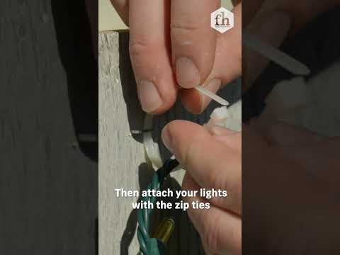 How To Easily Hang Christmas Lights On a Wooden Fence