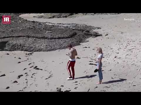 Justin Bieber dances before walking the beach with Hailey