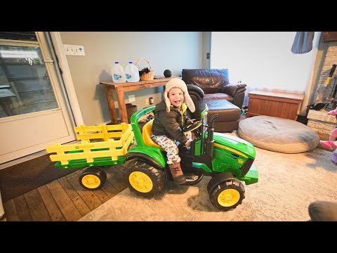 Building and Surprising cam with his first John Deere tractor toy.