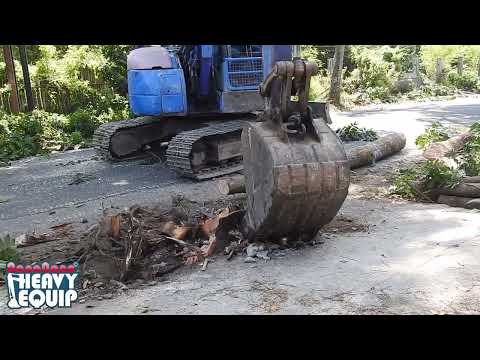 komatsu pc78 trying to digging tree root for road widening project