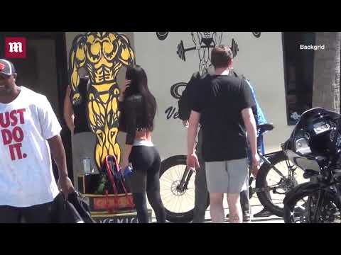 Arnold Schwarzenegger cruises by on his bike in Venice, CA