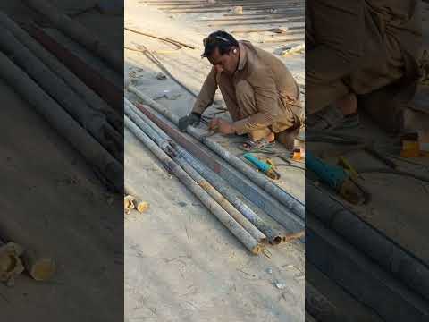 Construction work welding scaffolding pipes