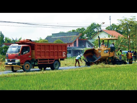 Cat Asphalt Paver Paving Asphalt hot mix on a road project