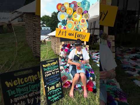 Pompom making in the sunshine at Art and Energy's round-house Glastonbury 2024 with The Mossy Carpet