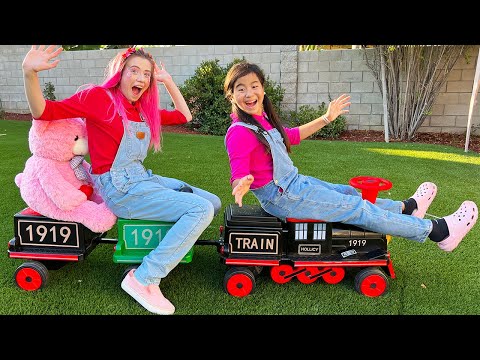 Jannie and Charlotte Play with Toy Trains