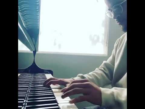 Jordan Fisher playing the piano