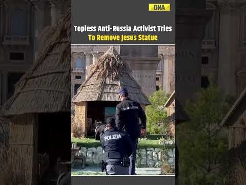 Topless Anti-Russia Activist Tries To Remove Jesus Statue From Vatican Crib #vatican #russia