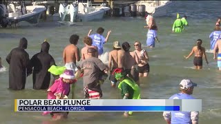 Hundreds partake in Polar Bear Plunge on Pensacola Beach