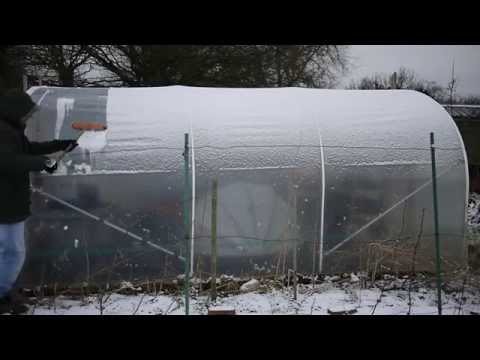 Clearing Snow From Polytunel