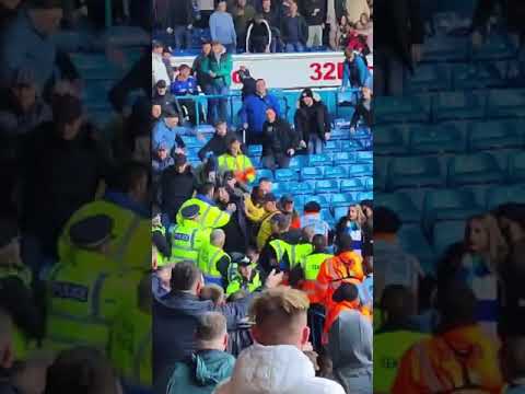 BIRMINGHAM CITY FANS ATTACK FEMALE STEWARDS AND THROW PYROS INTO THE LEEDS UNITED END