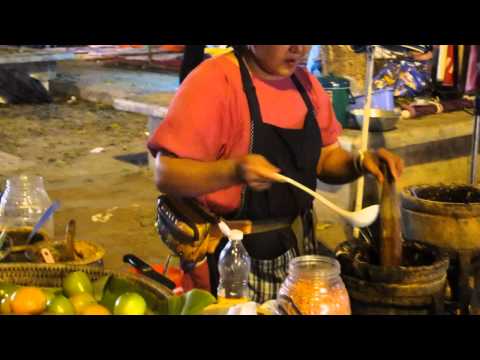 Street food in Thailand / Super spicy Thai papaya salad (Som tam)