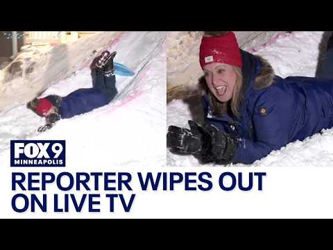 Reporter wipes out while sledding on live TV