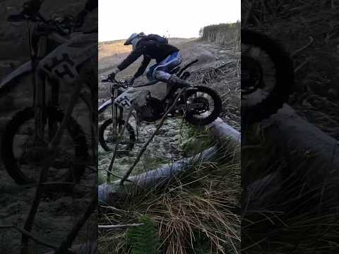 Dirt biker tries jumping Ice covered log