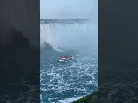 Breathtaking view of a Niagara City Cruises boat gliding past the majestic Canadian Horseshoe Falls!