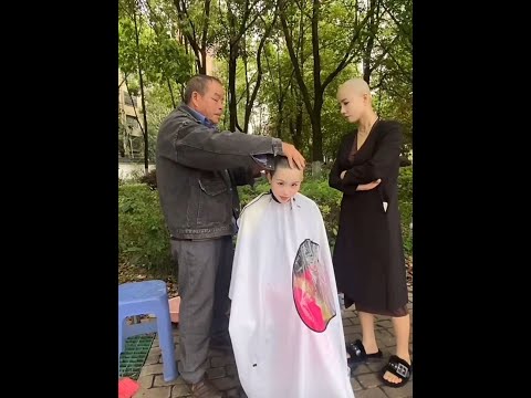 Twin sisters shave their heads in the park Part02